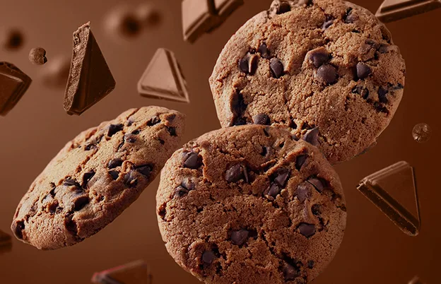 floating cookies on brown background