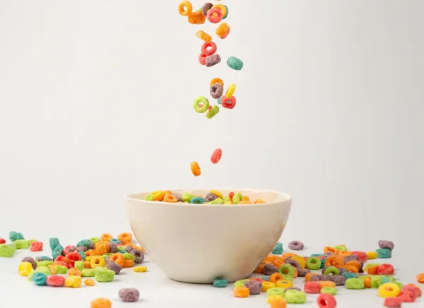 cereal being poured into a bowl