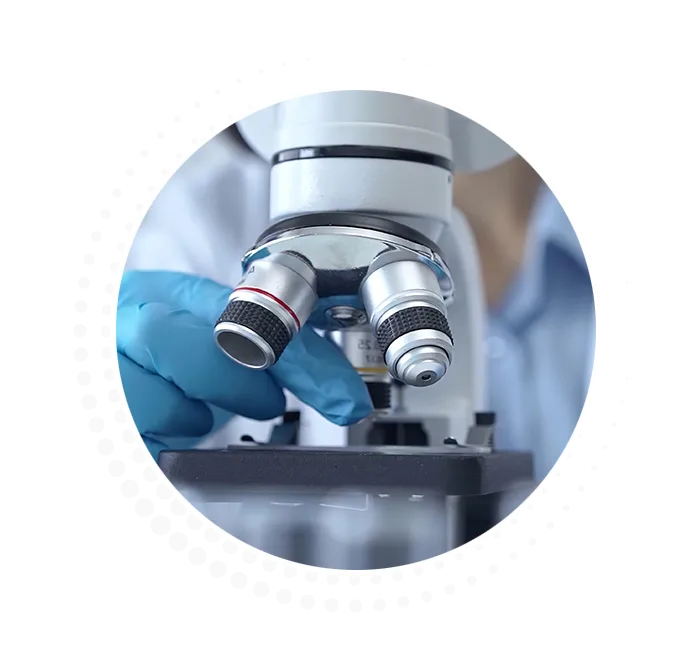 scientist looking in microscope