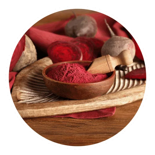 red food color powder with raw materials behind it, beets, beetroot powder