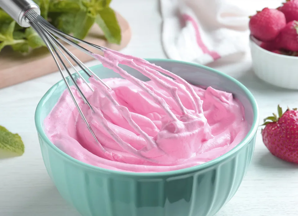 pink frosting in bowl